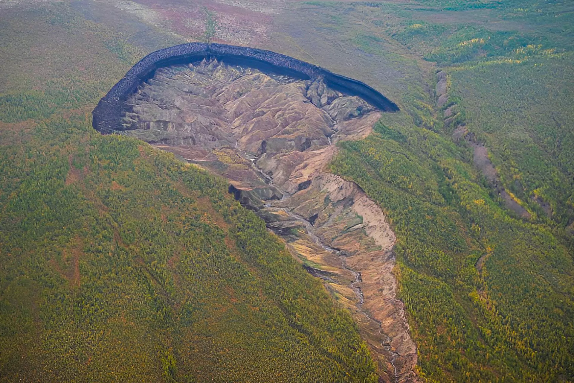 What began as a modest gully in the 1960s has now expanded into a vast 'sinkhole' destroying permafrost.