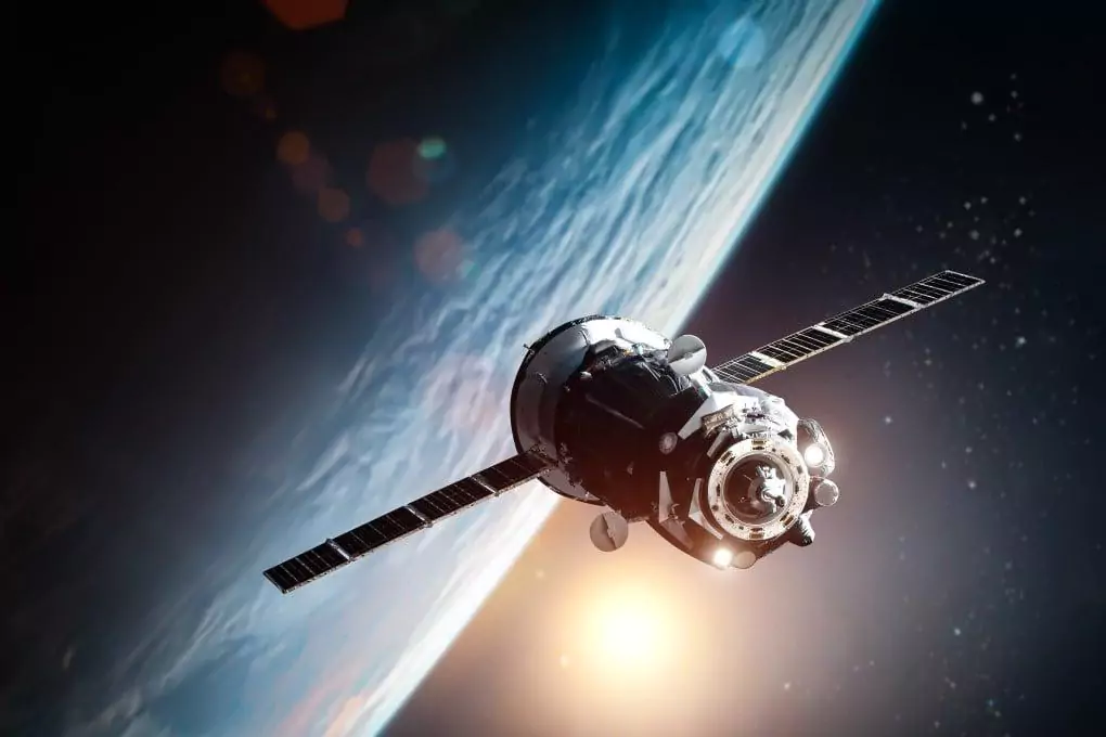 An artist's depiction shows a spacecraft orbiting close to Earth. On Thursday, Pentagon officials talked about speeding up the process of making space suitable for military use. Image: Shutterstock