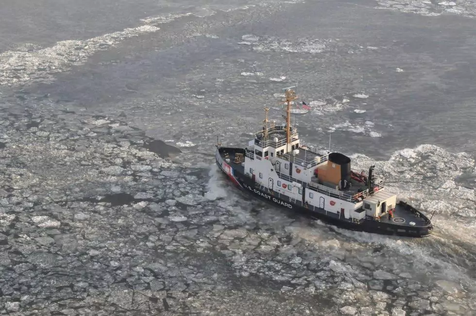 A U.S. Coast Guard tugboat plowing through icy waters