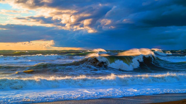 Illustration of ocean storm waves transmitting vibrations through Earth's core. Image generated by AI.