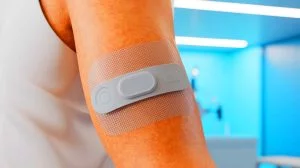 Illustration of a skin-safe adhesive for wearable medical devices that strengthens with sweat, generated by artificial intelligence.