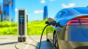 Illustration of an electric car charging at a station.