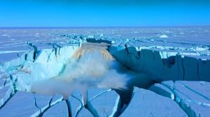 Illustration of a massive subglacial flood fracturing the Greenland Ice Sheet.