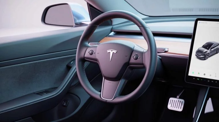 “‘This Company Exploits Drivers’: Tesla Sparks Outrage With A $15 Service Fixing A Problem It Allegedly Engineered” Illustration of Tesla Model 3 with Traditional Turn Signal Stalks Reinstalled.