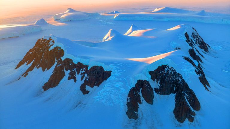 Illustration of the ancient Transantarctic Mountains beneath Antarctica's ice.