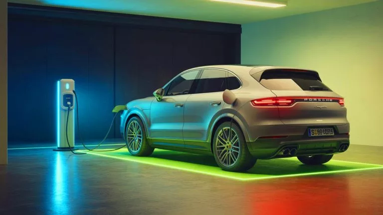 Illustration of a Porsche Cayenne Electric showcasing its inductive wireless charging system at IAA Mobility.